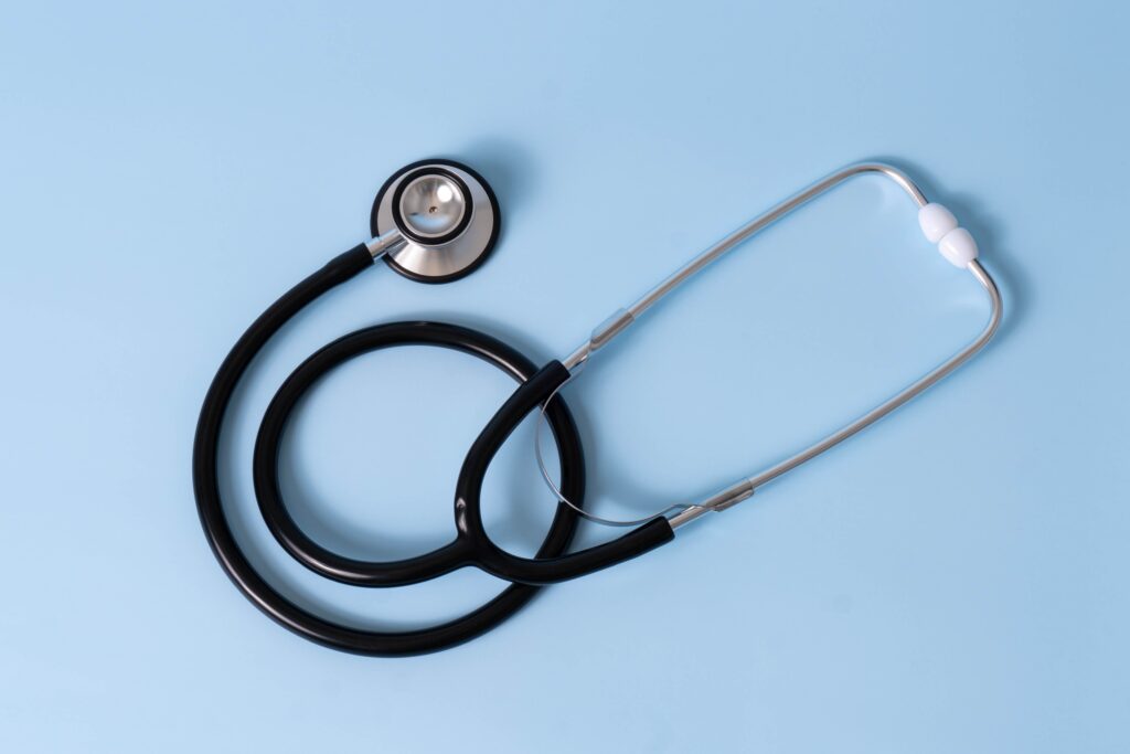 A stethoscope on a blue table