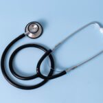 A stethoscope on a blue table