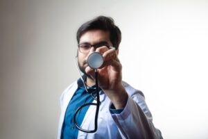 A man holds a stethoscope