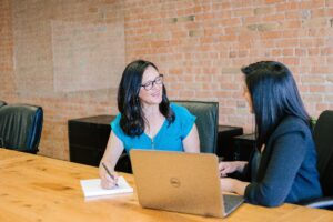 An investment advisor speaks with a client