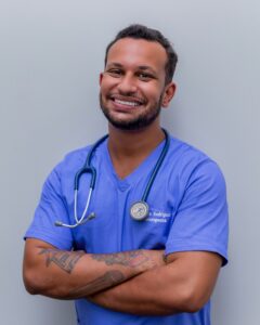 A young male doctor smiles