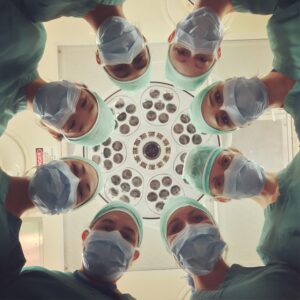A group of doctors form a circle
